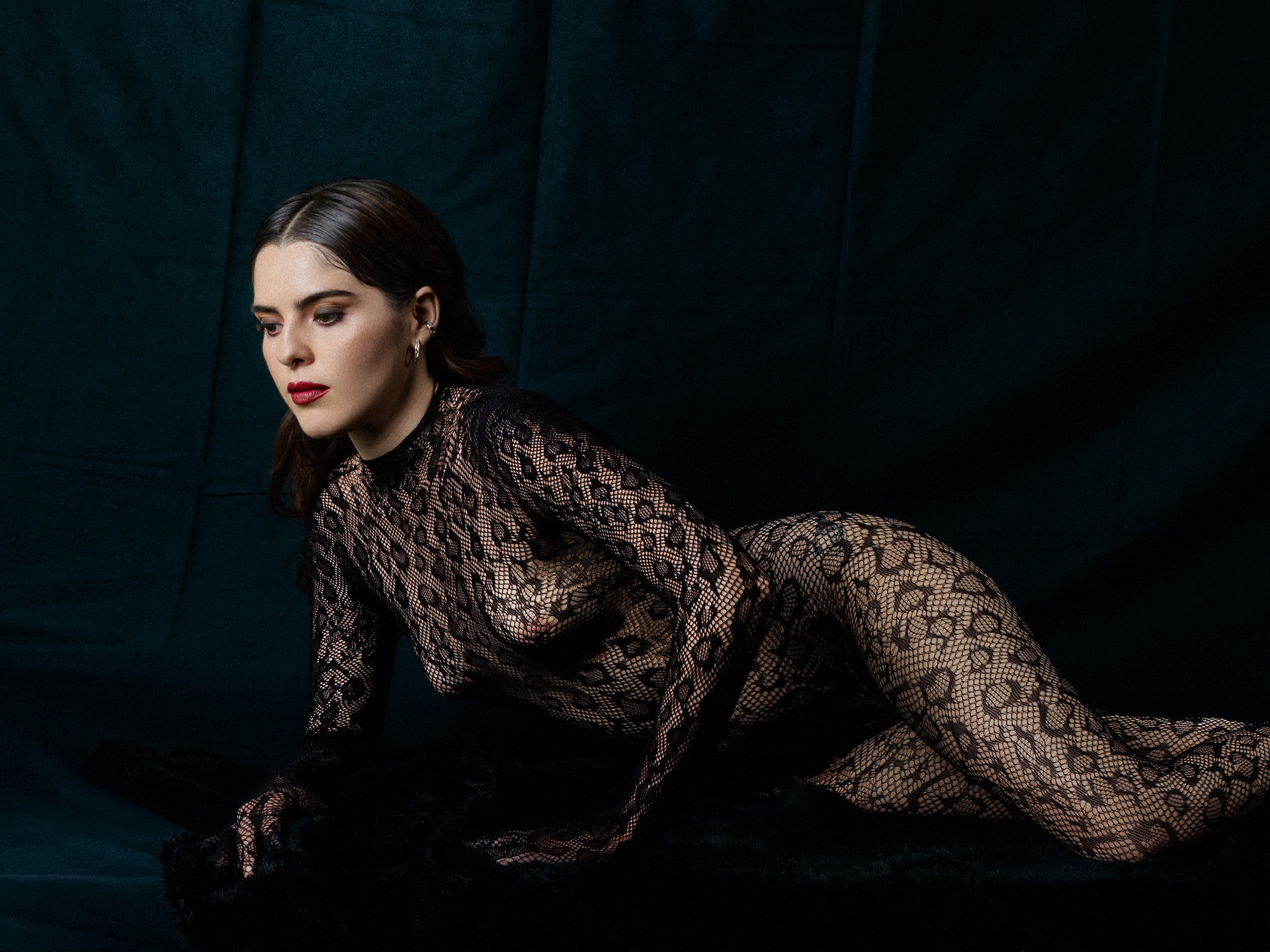 Salma moves through black lace with a prowling, tightly held intensity.